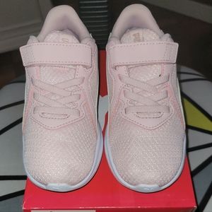 A pair of toddler girls sneakers.